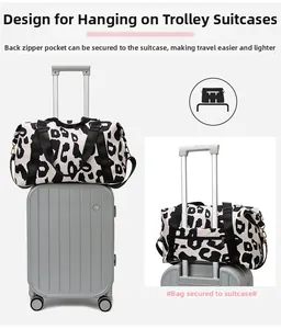 Close-up of leopard print travel bag featuring back sleeve for luggage trolley handles