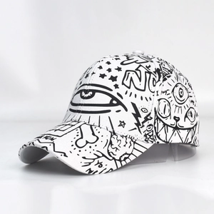 Unisex baseball cap with black graffiti print on white fabric for outdoor fashion