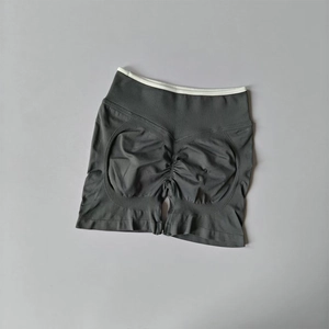 Detail view of seamless high-waisted yoga shorts with scrunch butt and contrast waistband
