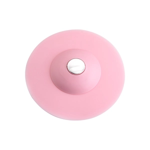Pink silicone sink stopper with silver push button for kitchen and bathroom drainage