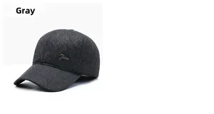 Detailed close-up of grey wool blend baseball cap showing fine weave texture and metal logo