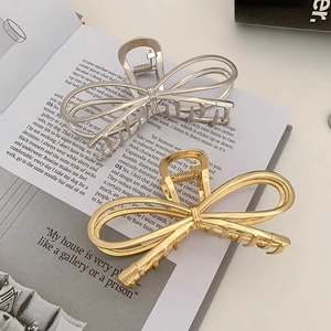 Elegant large metal bow claw clips in gold and silver finish for women hair styling