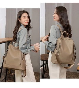 Detail of khaki pebbled leather backpack showing side and back view on model