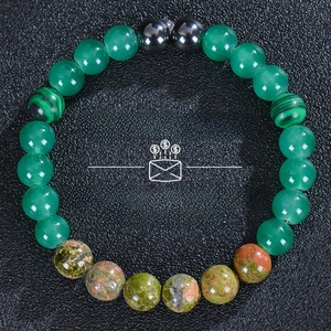 Detailed top view of natural green aventurine and hematite beaded stretch bracelet