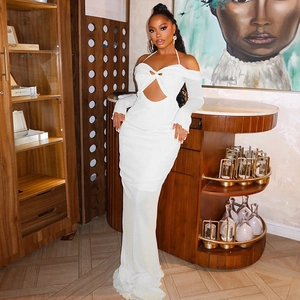 Detail of white hollow-out halter neck dress with long sleeves and pleated bodycon fit