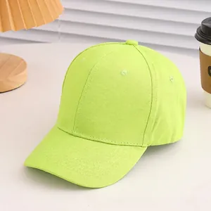 Detail of neon green cotton baseball cap with ventilation holes and reinforced stitching