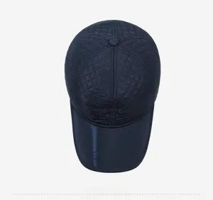 Top view of navy quilted thermal hat with ear protection and diamond stitching