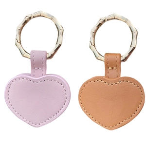Pink and camel heart-shaped leather hat clips with gold bamboo-style rings