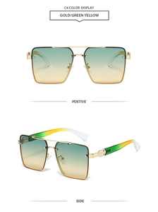 Close-up of golden square sunglasses featuring green-yellow gradient lenses and frames