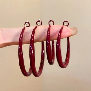 Minimalist deep red enamel hoop earrings with polished silver finish for women