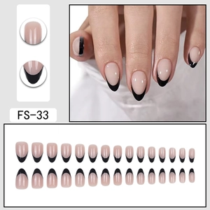 Short black French tip press-on nails in nude almond shape for elegant minimalist manicure