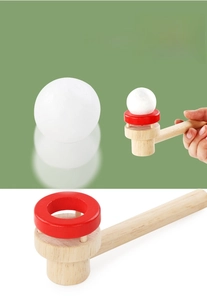 Detail showing the wooden floating ball toy for kids breathing and oral muscle training