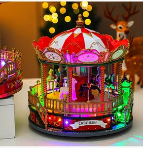 Christmas carousel music box with red and white canopy and colorful LED light effects