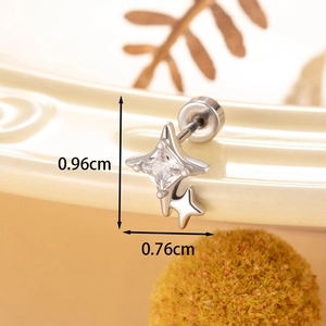 Titanium steel star stud earring with crystals and size markings on beige ceramic base