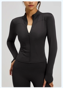 Front view detail of a slim-fit black yoga jacket with stand collar and zipper closure