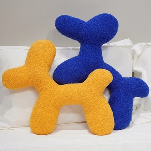 Soft bouclé balloon dog pillows in orange and blue for home sofa and bed decoration