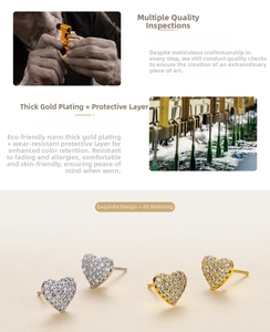 Detail of heart stud earrings with cubic zirconia and premium gold plating finish