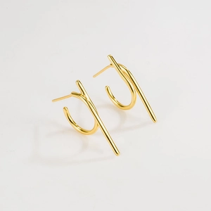 Close-up of elegant gold S925 sterling silver geometric hook earrings on white background