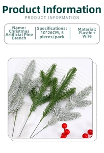 Detail of snowy artificial pine needle branches with red berries for Christmas DIY decor