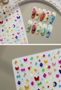 Detailed view of 3D nail art stickers M-112 featuring colorful stars, moons and eyes