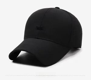 Detail view of black sport baseball cap showing laser-cut ventilation holes and sport patch