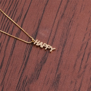 Golden box chain necklace with HAPPY pendant featuring micro-paved cubic zirconia