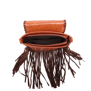Detail view of the brown bohemian fringe bag showing interior lining and zipper pocket