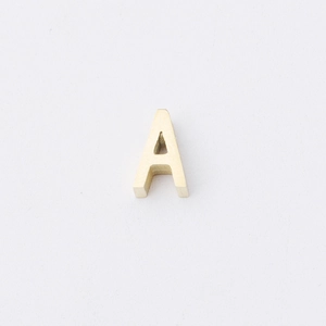 Macro shot of 1.8mm hole golden letter A bead with polished 3D stainless steel surface