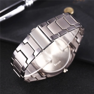 Detailed macro shot of silver stainless steel watch strap links with folding clasp mechanism
