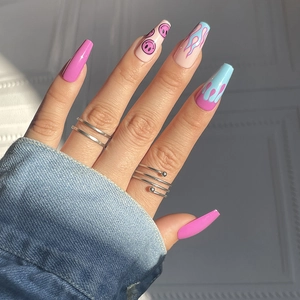 Coffin shaped press-on nails featuring cute pink flames and smile patterns for a trendy look