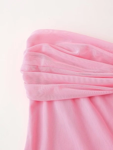 Detailed macro view of pink mesh fabric with pleated texture and delicate ruched design