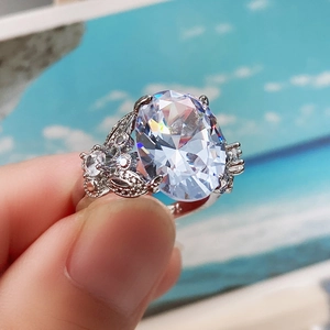 Macro shot of large oval cubic zirconia ring with leaf accents in silver finish