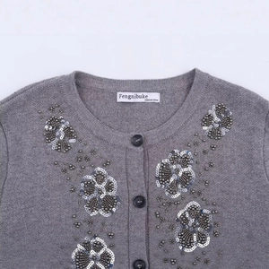 Women's crew neck grey knit cardigan with delicate floral bead embroidery and silver sequins