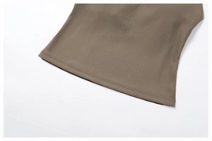 Close-up of ribbed yoga top hem showing professional double-needle stitching in khaki