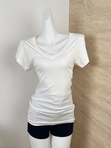 Detailed close-up of white Tencel wool V-neck T-shirt showing fine fabric texture and cut