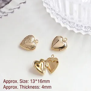 Detailed macro view of 14k gold plated heart locket pendant with floral relief pattern