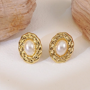 Vintage oval gold earrings with twisted rope border and white faux pearl center