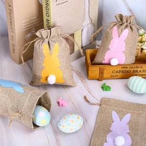 Linen Easter drawstring gift bags with colorful rabbit patterns and white pompom tails