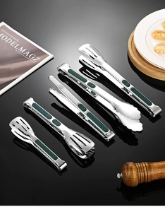 Detail of SUS 304 stainless steel food tongs with green silicone non-slip handles