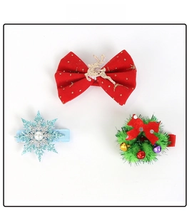 Detailed view of 3pcs Christmas hair clips including reindeer bow, snowflake, and bell wreath