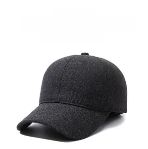 Close-up of wool texture and silver lightning emblem on a dark gray baseball cap