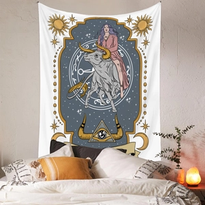 Detail view of Taurus astrology tapestry hanging over a bed in a cozy bedroom