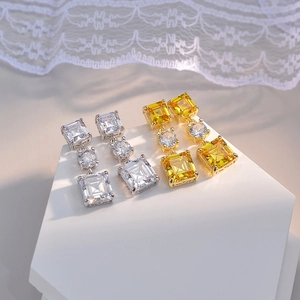 Elegant gold-plated drop earrings with stacked square and round cubic zirconia stones
