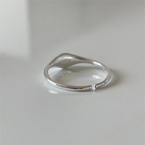Close-up of S925 hallmark on the inner band of a minimalist silver open signet ring