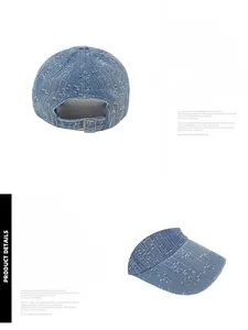 Detail of adjustable metal buckle and distressed denim brim on washed baseball cap