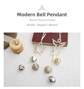 Detail of glitter angel and star ornaments with white satin bows and small bells