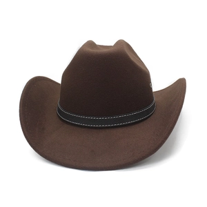 Detail of dark brown cowboy hat showing wool felt texture and white stitched leather band
