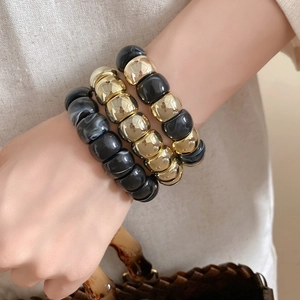 Three-piece stackable elastic bead bracelet set with gold metal and marble resin beads