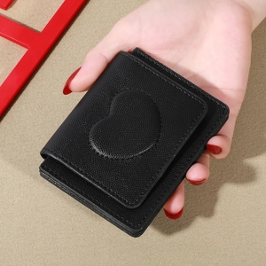 Minimalist black litchi texture short wallet for women featuring heart applique decoration