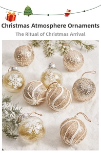 Detailed view of champagne gold and white Christmas balls with pearls and snowflake sequins